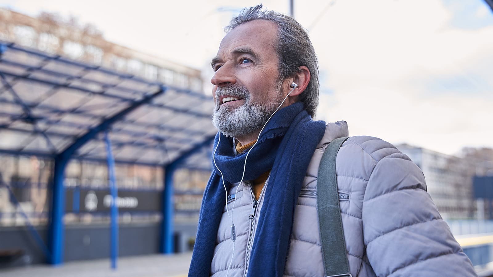 older man outdoors smiling