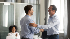 men shaking hands at work