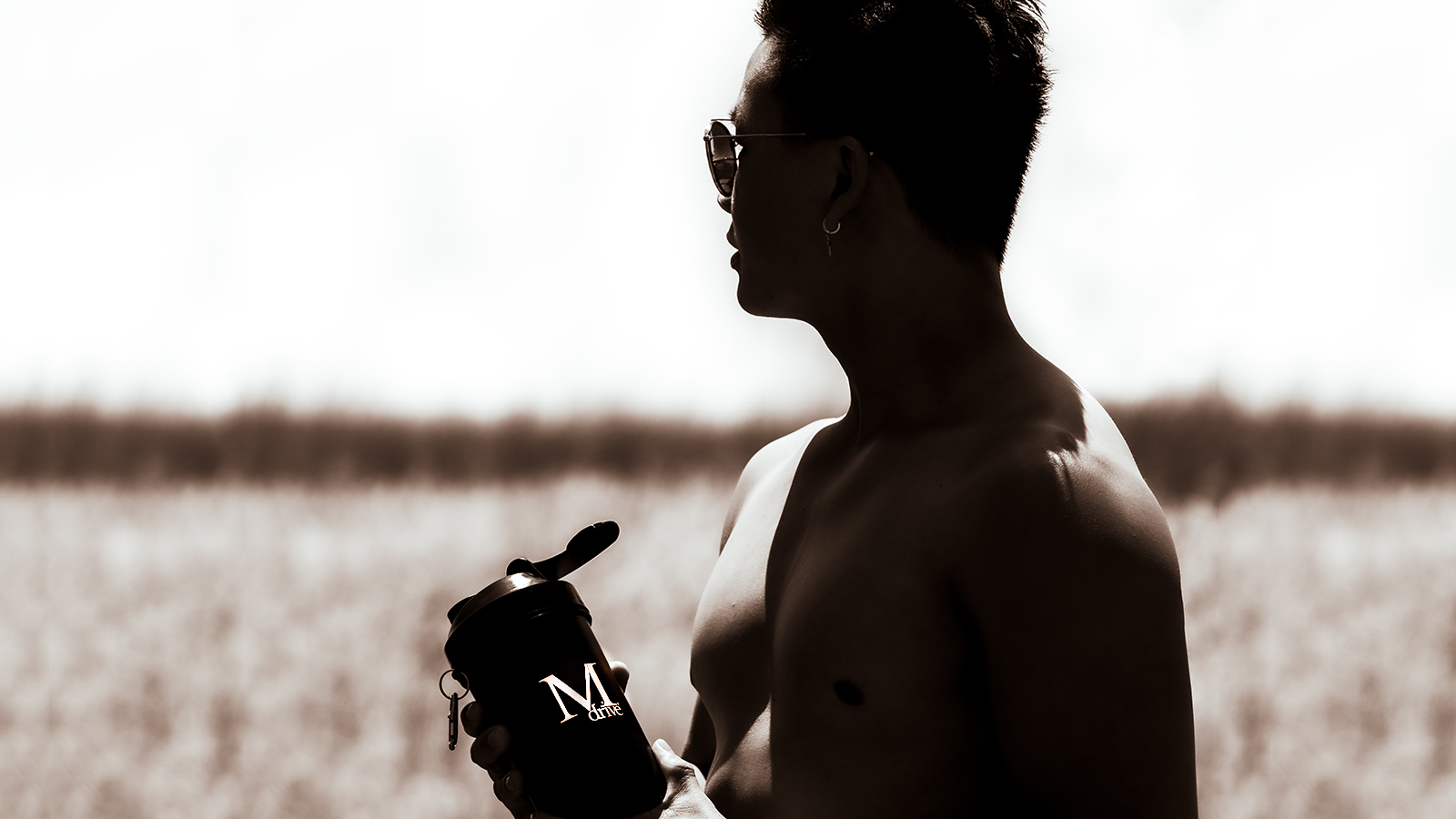 man measuring his waistline