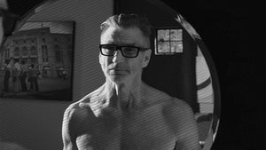 man standing in front of mirror
