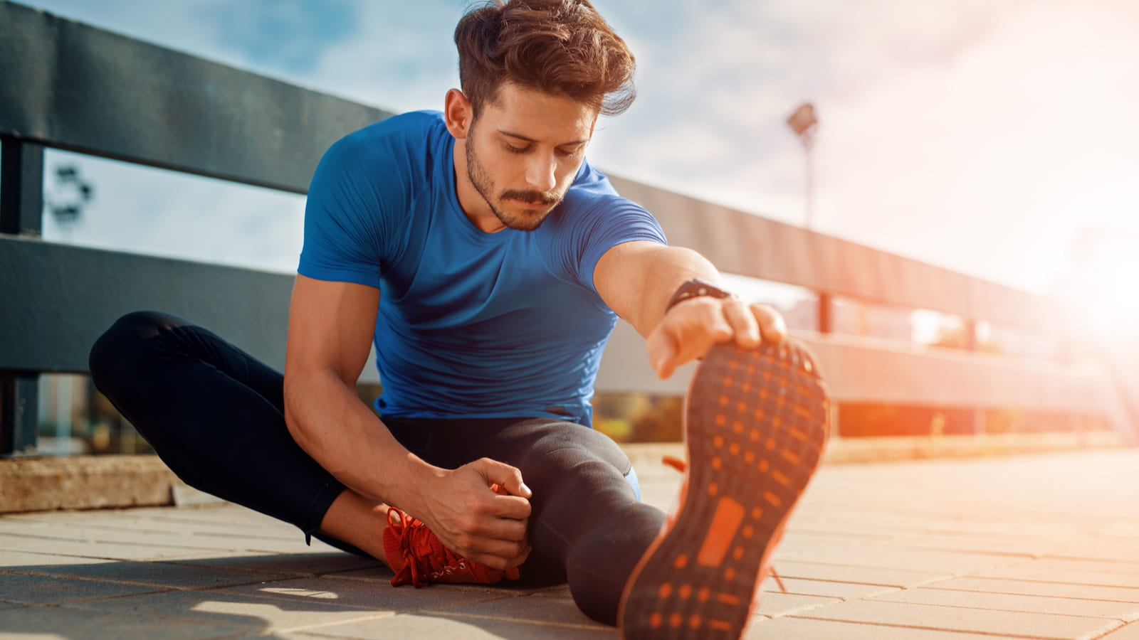 man stretching outside