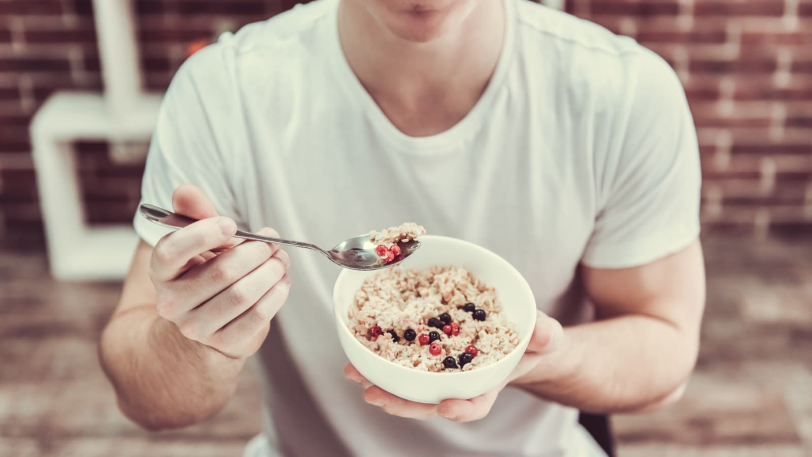 man eating high protein breakfast cereal