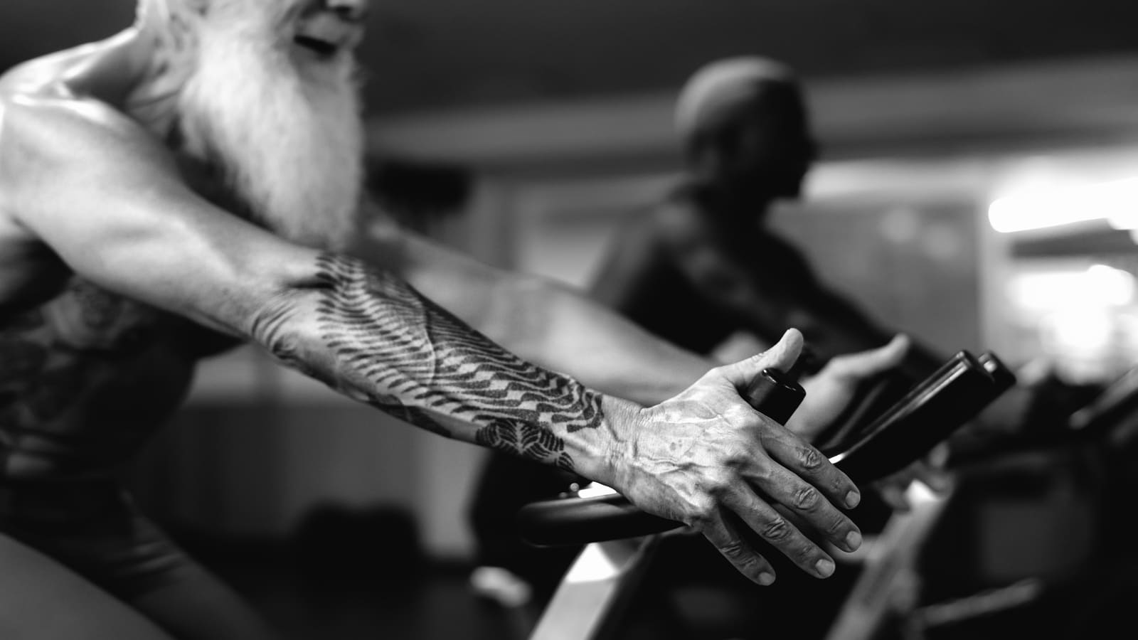 older man exercising on bike