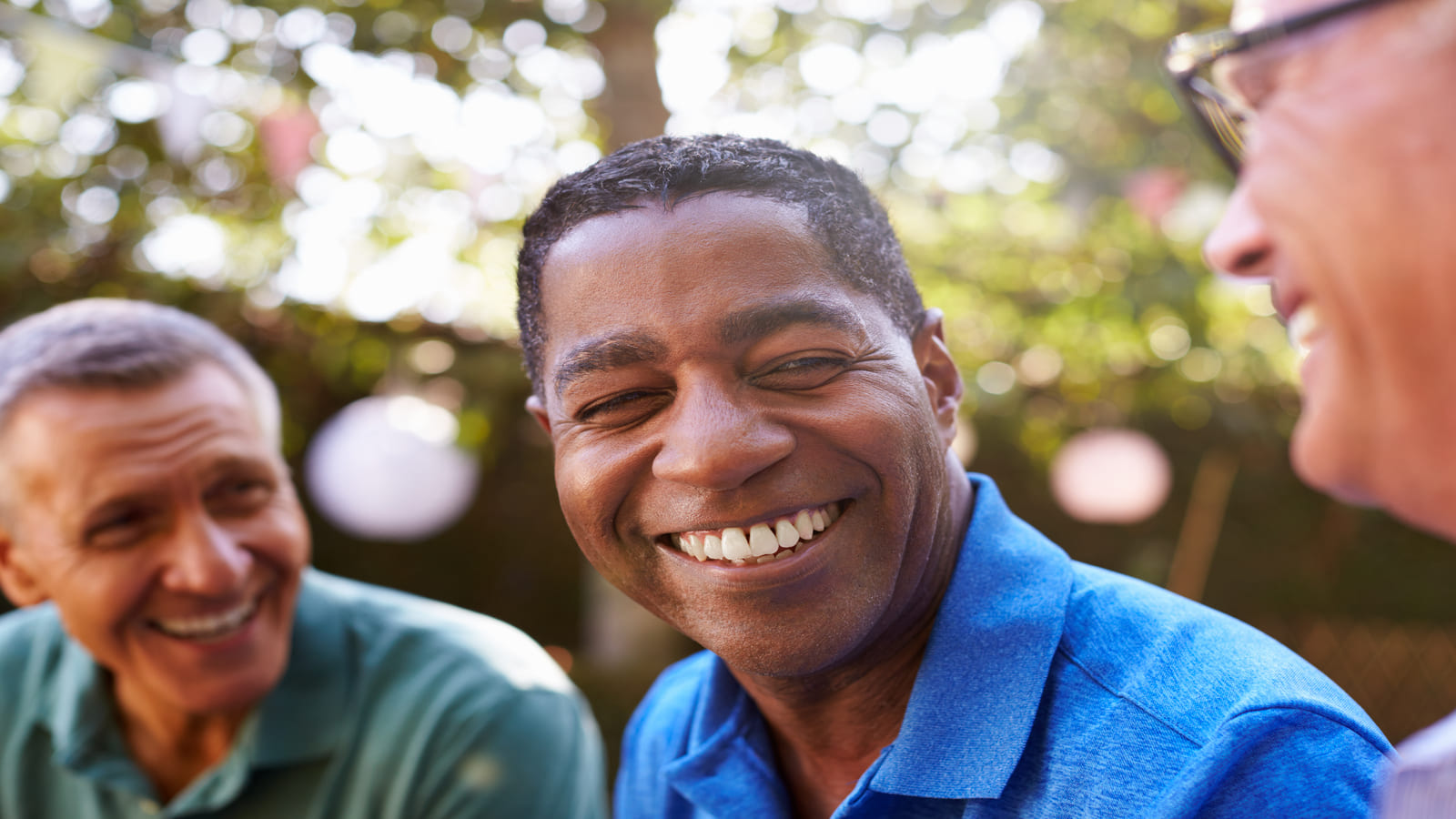 men outside laughing and talking